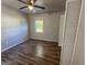 Bedroom with closet, ceiling fan and view to backyard at 710 Bluebird Se Dr, Conyers, GA 30094