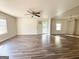 Bright living room with wood flooring, ceiling fan and natural light at 710 Bluebird Se Dr, Conyers, GA 30094