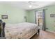 Bright bedroom featuring neutral tones, carpeted floors, and an airy ambiance at 115 Christie Ln, Mcdonough, GA 30252