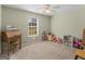 Comfortable bedroom with neutral walls, carpeted floor, and ceiling fan at 115 Christie Ln, Mcdonough, GA 30252