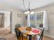 Cozy dining area with a charming round table and natural light, ideal for Gathering meals at 115 Christie Ln, Mcdonough, GA 30252
