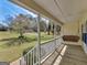 Inviting front porch featuring a hanging swing and a beautiful view of the flowering tree at 115 Christie Ln, Mcdonough, GA 30252