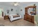 Spacious main bedroom with neutral walls, carpeted floors, and furnishings at 115 Christie Ln, Mcdonough, GA 30252