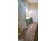 Bathroom features blue vanity with double sinks and updated floors at 9487 Lakeview Rd, Union City, GA 30291