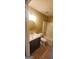 Bathroom with a round mirror and dark vanity at 9487 Lakeview Rd, Union City, GA 30291