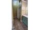 Bathroom with blue vanity, white counters, and updated floors at 9487 Lakeview Rd, Union City, GA 30291