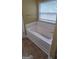 White bathtub with tile and a window with blinds at 9487 Lakeview Rd, Union City, GA 30291