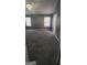 Large bedroom with neutral walls, new gray carpeting, and natural light at 9487 Lakeview Rd, Union City, GA 30291