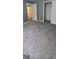 Spacious bedroom featuring neutral walls, new gray carpeting, an entry, and a closet at 9487 Lakeview Rd, Union City, GA 30291