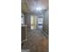 Upstairs hallway with carpet and three doorways at 9487 Lakeview Rd, Union City, GA 30291