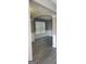 Bright living room with detailed wainscoting, hard surface floors, and a large window at 9487 Lakeview Rd, Union City, GA 30291