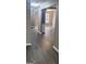 Open-concept living space with hard surface floors, wainscoting, and neutral paint colors at 9487 Lakeview Rd, Union City, GA 30291