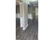 The living room features hard surface floors, wainscoting detail, and abundant natural light at 9487 Lakeview Rd, Union City, GA 30291