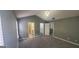 Spacious main bedroom with grey carpet and a modern chandelier at 9487 Lakeview Rd, Union City, GA 30291