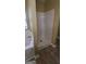 White shower unit separate from white tub in bath at 9487 Lakeview Rd, Union City, GA 30291
