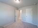 Carpeted bedroom with neutral walls, doors, and lighting at 77 Werner Brook Way Sw, Atlanta, GA 30354