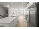 Kitchen with white countertops, stainless steel refrigerator and large island with sink and faucet at 77 Werner Brook Way Sw, Atlanta, GA 30354
