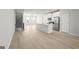 Open kitchen and living space featuring a large kitchen island and stainless steel appliances at 77 Werner Brook Way Sw, Atlanta, GA 30354