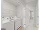 Bright laundry room boasts modern washer and dryer appliances at 77 Werner Brook Way Sw, Atlanta, GA 30354