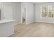Bright living space featuring an ensuite bathroom, wood-look floors, and natural light at 77 Werner Brook Way Sw, Atlanta, GA 30354