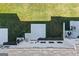 Top-down view of the backyard with green grass, small patio, and AC units at 8654 Lakeview Commons # 38, Jonesboro, GA 30238