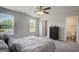 Bright bedroom with natural light, neutral walls and carpet, and attached ensuite bathroom at 8654 Lakeview Commons # 38, Jonesboro, GA 30238