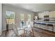 Inviting dining area next to kitchen with seating, modern decor and backyard views at 8654 Lakeview Commons # 38, Jonesboro, GA 30238