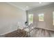 Bright dining area featuring a glass table, modern chairs, and natural light at 8654 Lakeview Commons # 38, Jonesboro, GA 30238