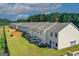 Exterior aerial view of townhomes with manicured lawns and private patios at 8654 Lakeview Commons # 38, Jonesboro, GA 30238