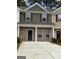 Charming townhome with brick facade, covered entryway, and well-maintained landscaping at 8654 Lakeview Commons # 38, Jonesboro, GA 30238