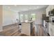 Modern kitchen with stainless steel appliances, granite countertops, and island seating at 8654 Lakeview Commons # 38, Jonesboro, GA 30238