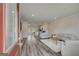 Bright, open-concept living area with hardwood floors and modern neutral decor at 8654 Lakeview Commons # 38, Jonesboro, GA 30238