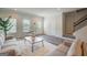 Inviting living room featuring hardwood floors, modern furniture, and abundant natural light at 8654 Lakeview Commons # 38, Jonesboro, GA 30238