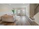 Comfortable living room with modern furniture, hardwood flooring, and natural light at 8654 Lakeview Commons # 38, Jonesboro, GA 30238