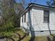 Side view of a white house with horizontal siding and a gray foundation at 6006 Blackhawk Se Trl, Mableton, GA 30126
