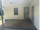 Cozy outdoor patio features a side entrance and neutral-colored siding at 6006 Blackhawk Se Trl, Mableton, GA 30126