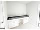 Bathroom area featuring white cabinetry and black countertops at 138 Silvercrest Dr # 169, Acworth, GA 30101