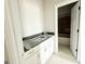 New bathroom vanity featuring gray countertop, white cabinetry, and modern gold hardware at 138 Silvercrest Dr # 169, Acworth, GA 30101