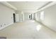 Large bedroom with tray ceiling, light gray walls, and natural light from two windows at 138 Silvercrest Dr # 169, Acworth, GA 30101