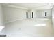 Spacious bedroom with tray ceiling, white walls, and multiple doorways at 138 Silvercrest Dr # 169, Acworth, GA 30101