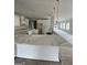 Bright kitchen featuring white cabinets, a large island, and modern lighting fixtures at 138 Silvercrest Dr # 169, Acworth, GA 30101