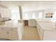 Well-lit kitchen featuring dual islands, white cabinets, and ample counter space at 138 Silvercrest Dr # 169, Acworth, GA 30101