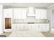 Modern kitchen featuring sleek white cabinetry, spacious countertops, and stylish fixtures at 138 Silvercrest Dr # 169, Acworth, GA 30101