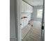 Laundry room featuring white cabinets and a large window at 138 Silvercrest Dr # 169, Acworth, GA 30101