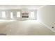 Spacious living room with large windows, fireplace, and modern design elements at 138 Silvercrest Dr # 169, Acworth, GA 30101