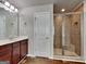 Updated bathroom featuring a tiled shower, wood look flooring, and a modern vanity at 3741 Upland Dr, Mcdonough, GA 30253