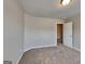 Bedroom with neutral walls, carpeted floor, and a doorway to another room at 3741 Upland Dr, Mcdonough, GA 30253