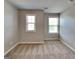 Bright bedroom featuring natural light, neutral walls, and plush carpet at 3741 Upland Dr, Mcdonough, GA 30253