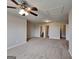 Spacious bedroom featuring neutral walls, plush carpet, and an overhead ceiling fan at 3741 Upland Dr, Mcdonough, GA 30253