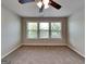 Well-lit bedroom offering carpeted floors and multiple windows, providing ample natural light and a cozy atmosphere at 3741 Upland Dr, Mcdonough, GA 30253